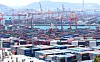 Shipping containers are stacked at Busan Port on April 30. [YONHAP]