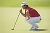 Korea's Tom Kim looks at the lie of his putt on the 5th green during the first round of the men's golf event at the Paris Olympics at Le Golf National in Saint-Quentin-en-Yvelines, France on Thursday. [AP/YONHAP]