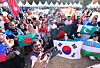International students pose for photos at a culture festival held on Nov. 7, 2024, at Ajou University in Suwon. [YONHAP]