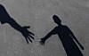 An image shows a child reaching out to seek help. [SHUTTERSTOCK]