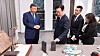 President Lee Jae Myung examines the Xiaomi smartphone presented to him by Chinese President Xi Jinping on Nov. 2. [YONHAP]