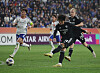 Ulsan HD's Lee Dong-gyeong, right, shoots during the first leg of the 2023-24 AFC Champions League semifinals against Yokohama F. Marinos at Ulsan Munsu Football Stadium in Ulsan on Wednesday. [YONHAP]
