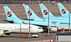 Korean Air Lines and Asiana Airlines aircraft parked at Incheon International Airport on Dec. 1. [NEWS1]