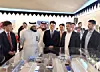 Third from left, Han Young-seuk, former vice chairman at HD Hyundai Heavy Industries, looks at the blueprint of the Makeen marine engine plant in Saudi Arabia at the groundbreaking ceremony with other Saudi officials in June 2023. [HD HYUNDAI]