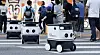 Delivery robots from Neubility, a domestic robot developer, navigate a crosswalk. [YOGIYO]