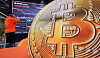 The prices of digital assets including the Bitcoin are displayed on a screen at Bithumb Lounge in Seocho District, southern Seoul, on Jan. 23. [NEWS1]