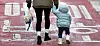 A parent and their child go to a day care center in Seoul on Feb. 11. [NEWS1]