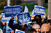 People hold placards during a procession with Los Angeles Mayor Karen Bass and faith and community organizations members, as they march for a field hearing titled ‘Due Process for All: Exposing Trump’s Mass Deportation Machine,’ to protest what they describe as the unlawful detention of U.S. citizens and immigrants by federal agents, in Los Angeles, California, on Nov. 24. [REUTERS/YONHAP]