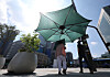 People seek shade to avoid the sun at Gwanghwamun Square in Jongno District, central Seoul, on Aug. 5, 2025, amid a heat wave. [YONHAP]