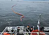 Authorites work to remove the spilled diesel fuel off the coast of Changown, South Gyeongsang, on May 11. [CHANGWON COAST GUARD STATION]