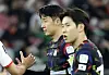 Tottenham Hotspur captain Son Heung-min, center, and Lee Kang-in react during the Asian Cup semifinal between Korea and Jordan in Qatar on Feb. 6. [YONHAP]