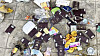 A street photo from Poipet, Cambodia, posted on a Thai online community last June, shows a pile of Thai and other foreign passports scattered around a trash can [SCREEN CAPTURE]
