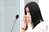 Hanni of girl group NewJeans sheds tears at a parliamentary audit on Oct. 15, 2024. [JOINT PRESS CORPS]