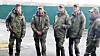 Five men presumed to be North Korean soldiers stand outside a building in an unknown location in this photo released by Russian media outlet Astra in October 2024. [SCREEN CAPTURE]
