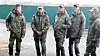 Five men presumed to be North Korean soldiers stand outside a building in an unknown location in this photo released by Russian media outlet Astra in October 2024. [SCREEN CAPTURE]