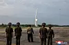 North Korean officials watch as a short-range ballistic missile (SRBM) is being launched on Sept. 19, 2024, in this file photo released by the state-run Korean Central News Agency. [KOREAN CENTRAL NEWS AGENCY]
