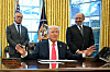 U.S. President Donald Trump speaks to the press after signing an executive order, alongside Secretary of Health and Human Services Robert Kennedy Jr., left, and Secretary of Commerce Howard Lutnick, right, at the Oval Office of the White House in Washington on Feb. 25. [AFP]