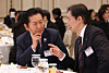Democratic Party leader Jung Chung-rae, left, and Rebuilding Korea Party leader Cho Kuk speak during a New Year's event at the Blue House in Jongno District, central Seoul, on Jan. 2. [JOINT PRESS CORPS]