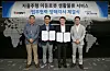 From second from left: Lee Hyoun-mok, head of global logistics center at Hyundai Glovis, stands with Twinny co-CEOs Cheonn Hong-seok and Cheon Young-seok. [HYUNDAI GLOVIS]