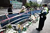 Police officers inspect the site of a car crash that killed nine people near Seoul City Hall in central Seoul on July 4, three days after the accident. [NEWS1]