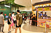 Vietnamese customers wait in a long line to buy 10-won bread, a bready street snack filled with cheese, that are usually sold in tourist areas of Korea, at the Lotte Mall West Lake Hanoi in Vietnam. [LOTTE SHOPPING]