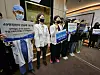 Medical professors at Kangwon National University picket in front of a meeting hall on campus in Gangwon on Tuesday, demanding the admissions quota hike in medical schools to be scrapped. [NEWS1]