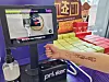 A temporary tattoo is applied to a customer's inner forearm at a CU convenience store in Seoul. [BGF RETAIL]
