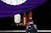 A wooden plaque showing the name of Japan's Prime Minister Shigeru Ishiba, second from right, is seen with a ″masakaki″ tree that he sent as an offering to the controversial Yasukuni Shrine on the first day of the Spring Festival in Tokyo on April 21. [AFP/YONHAP]