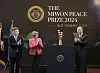 Former UN Secretary-General Ban Ki-moon, right, claps as he receives the trophy for the inaugural Miwon Peace Prize on behalf of The Elders at Kyung Hee University's Peace Hall in Dongdaemun District, eastern Seoul, on Friday. Kyung Hee University Chancellor Choue In-won, far left, and former Director-General of Unesco Irina Bokova clap to congratulate Ban. [PARK SANG-MOON]