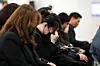 Families of the victims of the Jeju Air crash weep at a memorial hall set up at the Muan Airport South Jeolla on April 5. [YONHAP]
