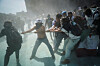 Demonstrators try to pull down a barrier as riot control agents are sprayed on them during a protest against insecurity and corruption in the country, on Mexico City, Mexico, Nov. 15. [REUTERS/YONHAP]