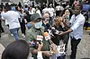 Colonel Valdez speaks to reporters at the National Institute of Forensic Pathology in Santo Domingo, Dominican Republic on April 9, while holding photos of people who remain missing after a roof collapsed at the Jet Set nightclub during a merengue concert. [AP/YONHAP]