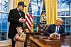 Tesla and SpaceX CEO Elon Musk with his son X Æ A-Xii join US President Donald Trump as he signs executive orders in the Oval Office of the White House in Washington, DC, on Feb. 11. [AFP/YONHAP]