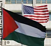 The national flag of Palestine in the foreground and the United States flag raised during a press conference in front of the U.S. Embassy in central Seoul on Feb. 5, in which protesters denounced President Donald Trump's Gaza Strip plan. [YONHAP]