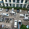 A photo posted on Telegram shows people getting out of large vans in a neighborhood in Sihanoukville, Cambodia [SCREEN CAPTURE]