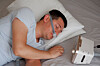 A man wearing under the nose nasal PAP aid and uses a CPAP machine for sleeping in this file photo. [GETTY IMAGES]