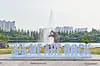 The slogan 'We Are Back' is displayed at Ilsan Lake Park in Goyang, Gyeonggi, as part of the 2025 BTS Festa. [BIGHIT MUSIC]