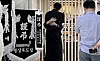 The mother of a worker, who died after being hit by a train in Cheongdo, North Gyeongsang, on Aug. 19, hugs her son's friend at his funeral on Aug. 20. [NEWS1]