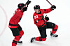 Canada's Mitch Marner, 93, and Macklin Celebrini, 17, celebrate after Marner scored the winning goal during the overtime period of a men's ice hockey quarterfinal game between Canada and Czechia at the 2026 Winter Olympics, in Milan, Italy, on Feb. 18.  [AP/YONHAP]