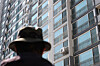 A pedestrian on April 15 walks by the apartment where a man in his 50s killed five family members in Yongin, Gyeonggi. [NEWS1]