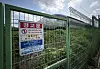 A danger notice is put up on a fence outside the railway in Cheongdo, North Gyeongsang, where seven workers were hit by a train on Aug. 19. [YONHAP]