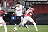 Tottenham's Son Heung-min, left, challenges for the ball with AZ Alkmaar's Wouter Goes during a Europa League round of 16 first leg match at AFAS Stadium in Alkmaar, Netherlands on March 6.  [AP/YONHAP]