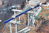 Authorities examine an expressway construction site in Anseong on Feb. 26, a day after an accident left four people dead and six injured. [YONHAP]