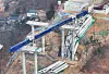 Authorities examine an expressway construction site in Anseong on Feb. 26, a day after an accident left four people dead and six injured. [YONHAP]