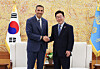 President Lee Jae Myung, right, shakes hands with Khaldoon Khalifa Al Mubarak, chairman of the Executive Affairs Authority of Abu Dhabi, prior to their talks at the Blue House in central Seoul on Jan. 15. [YONHAP]