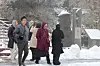 People experience the snowfall on Mount Halla on Jeju Island on Nov. 13, 2023. [YONHAP]