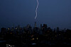 A bolt of lightning strikes the spire of One World Trade Center in the Manhattan Skyline during an evening thunderstorm in New York City on July 14. [UPI/YONHAP]