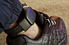 A security electronic tag is wrapped around a person's ankle in this file photo. [GETTY IMAGES BANK]