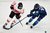 Canada's Emily Clark, left, challenges Finland's Jenniina Nylund during a preliminary round match of women's ice hockey between Finland and Canada at the 2026 Winter Olympics in Milan on Feb. 12.  [AP/YONHAP]