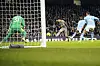 Tottenham's Son Heung-min, center, scores the opening goal during a Premier League match against Manchester City and at the Etihad in Manchester on Sunday. [AP/YONHAP]